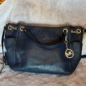 Michael Kohrs cross body navy blue bag